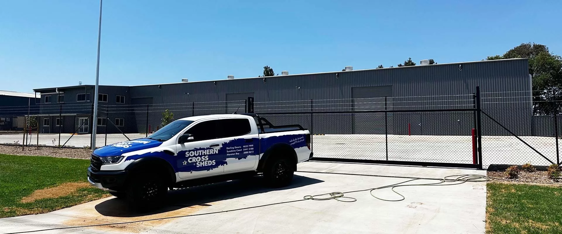 finished shed with car outside gates