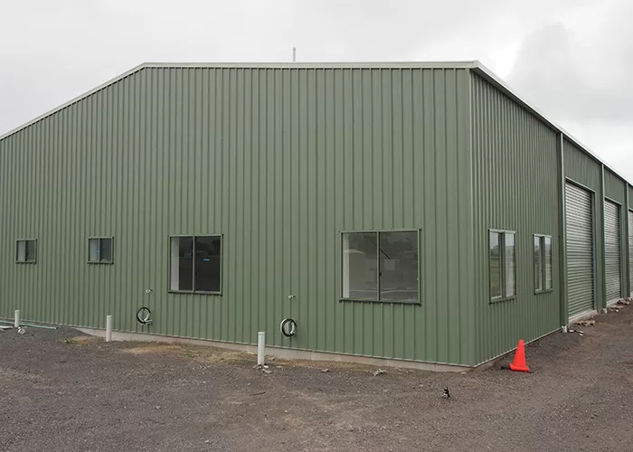 side of green shed facility